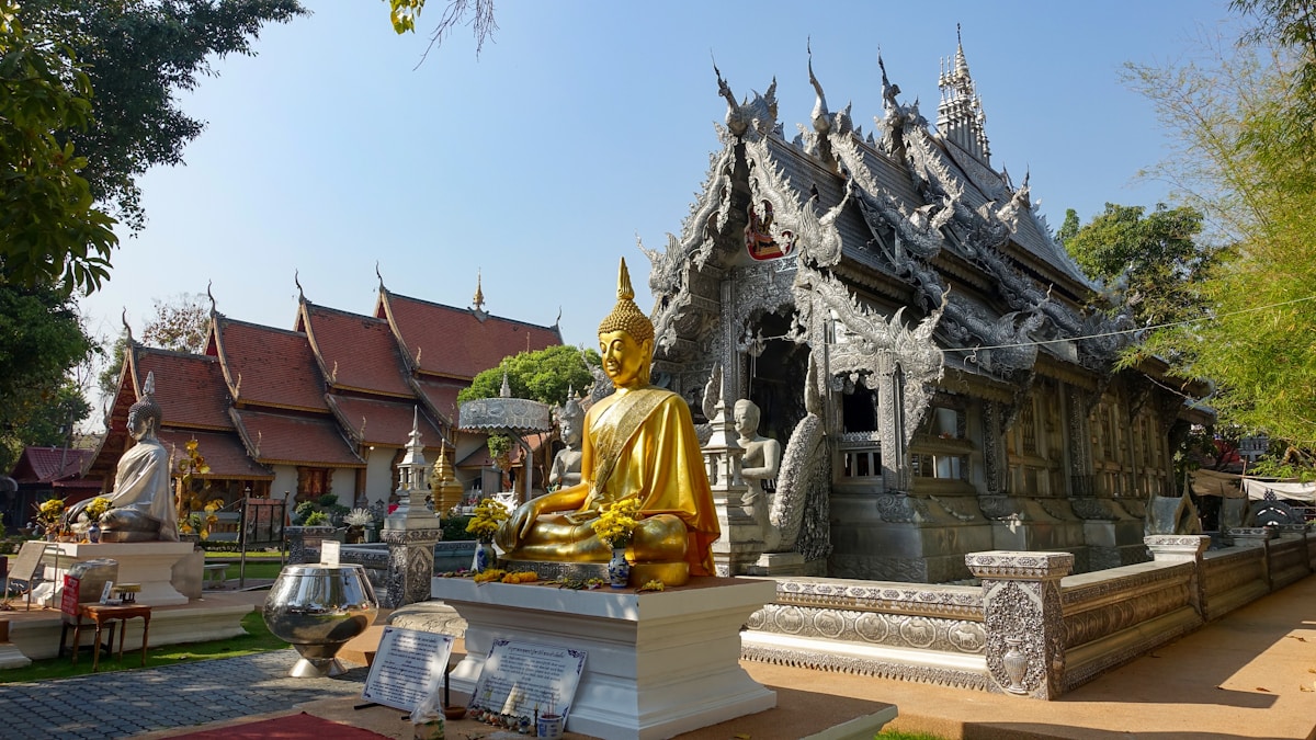 Golden Buddha statue at silver temple, Chiang Mai — Thailand in June